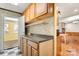 Kitchen features wood cabinets and countertop at 7933 Cherry Point Dr, Denver, NC 28037