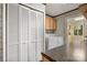 Laundry room with washer, dryer, and cabinets at 7933 Cherry Point Dr, Denver, NC 28037