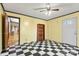 Living room with checkerboard floor and bookcase at 7933 Cherry Point Dr, Denver, NC 28037