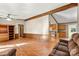 Open living room and kitchen with laminate floors at 7933 Cherry Point Dr, Denver, NC 28037