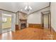 Living room with stone fireplace and wood flooring at 7933 Cherry Point Dr, Denver, NC 28037