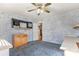 Home office with built-in shelving and carpet at 7933 Cherry Point Dr, Denver, NC 28037