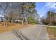 Residential street with mature trees and lake access at 7933 Cherry Point Dr, Denver, NC 28037