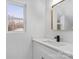 Modern bathroom with white vanity and gold mirror at 902 N Mountain St, Cherryville, NC 28021