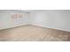 Well-lit bedroom featuring wood-look floors at 902 N Mountain St, Cherryville, NC 28021