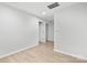 Simple bedroom with wood-look floors and access to hallway at 902 N Mountain St, Cherryville, NC 28021