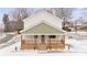 Two-story house with light-colored siding, a green accent, and a front porch at 902 N Mountain St, Cherryville, NC 28021