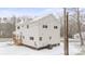 Two-story house exterior with light beige siding, covered porch, and snowy yard at 902 N Mountain St, Cherryville, NC 28021