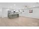 Modern kitchen with island, stainless steel appliances, and white cabinets at 902 N Mountain St, Cherryville, NC 28021