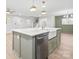 Modern kitchen island with a farmhouse sink and stainless steel dishwasher at 902 N Mountain St, Cherryville, NC 28021