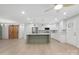 Modern kitchen with a large island, white cabinets, and stainless steel appliances at 902 N Mountain St, Cherryville, NC 28021