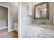 Bathroom features granite countertop, white vanity, and a large mirror at 9435 Squirrel Hollow Ln, Charlotte, NC 28720