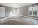 Spacious bedroom with hardwood floors and access to a deck at 9435 Squirrel Hollow Ln, Charlotte, NC 28720