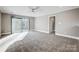 Bright bedroom with sliding glass door to balcony at 9435 Squirrel Hollow Ln, Charlotte, NC 28720