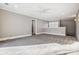 Spacious bonus room with neutral carpeting and natural light at 9435 Squirrel Hollow Ln, Charlotte, NC 28720