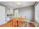 Bright dining room features hardwood floors, built-in shelving, and a charming table at 9435 Squirrel Hollow Ln, Charlotte, NC 28720