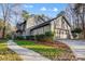 Side view of the house, highlighting the garage and landscaping at 9435 Squirrel Hollow Ln, Charlotte, NC 28720