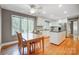 Spacious kitchen with island, hardwood floors, and stainless steel appliances at 9435 Squirrel Hollow Ln, Charlotte, NC 28720