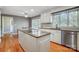 Kitchen with granite countertops, white cabinets, and island at 9435 Squirrel Hollow Ln, Charlotte, NC 28720