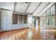 Spacious living room with hardwood floors, built-ins, and fireplace at 9435 Squirrel Hollow Ln, Charlotte, NC 28720