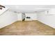 Spacious finished basement with wood-look floors and a fireplace at 1016 Patricia Ave, Harrisburg, NC 28075