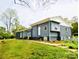 Updated exterior boasts a modern gray color scheme and spacious lawn at 1016 Patricia Ave, Harrisburg, NC 28075