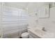 Clean bathroom with a shower/tub combo and white tile at 1028 White Ln, Gastonia, NC 28052