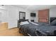 Bedroom with brick fireplace, hardwood floors, and a black sleigh bed at 1028 White Ln, Gastonia, NC 28052