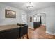 Bright dining area with a table and chairs, offering views into the living room and kitchen at 1028 White Ln, Gastonia, NC 28052