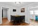 Cozy dining area with a small table and chairs, near kitchen and hallway at 1028 White Ln, Gastonia, NC 28052
