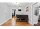 Dining area with a table and chairs, offering access to the kitchen and bedroom at 1028 White Ln, Gastonia, NC 28052