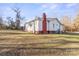 White house with red brick base and yard at 1028 White Ln, Gastonia, NC 28052