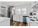 Kitchen with white cabinets, stainless steel appliances, and light flooring at 1028 White Ln, Gastonia, NC 28052