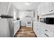 Efficient kitchen featuring white cabinets and modern appliances at 1028 White Ln, Gastonia, NC 28052