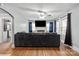 Spacious living room featuring hardwood floors, a fireplace, and ample natural light at 1028 White Ln, Gastonia, NC 28052