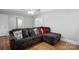 Living room with hardwood floors and a comfortable sectional sofa at 1028 White Ln, Gastonia, NC 28052