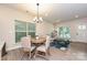 Bright dining area with wooden table and chairs near the kitchen at 110 Nat Barber Ave, Gastonia, NC 28052