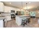 Modern kitchen with granite countertops, white cabinets, and a large island at 110 Nat Barber Ave, Gastonia, NC 28052