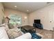 Bright living room featuring hardwood floors, comfy sofa, and a large window at 110 Nat Barber Ave, Gastonia, NC 28052