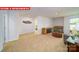 Open living room featuring a gray sofa, stylish furniture, and natural light at 11127 Cardinal Creek Ave, Charlotte, NC 28215