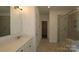 Bright bathroom featuring a spacious shower and granite-topped vanity for enhanced style and functionality at 1136 Yellow Springs Dr, Huntersville, NC 28078