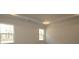 Neutral bedroom with large windows, tray ceiling, recessed lighting, and modern fixtures at 1136 Yellow Springs Dr, Huntersville, NC 28078