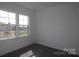 Bright bedroom with a double window offering views of the surrounding neighborhood, cozy carpeting at 1136 Yellow Springs Dr, Huntersville, NC 28078