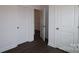 Hallway with hardwood floors with white doors and trim at 1136 Yellow Springs Dr, Huntersville, NC 28078