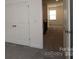 Hallway features carpet, view of the loft area, and access to the bedroom providing ample room at 1136 Yellow Springs Dr, Huntersville, NC 28078