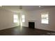Bright living room with hardwood floors, a fireplace, and recessed lighting at 1136 Yellow Springs Dr, Huntersville, NC 28078