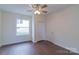 Bright bedroom with hardwood floors and double closets at 117 Falls Rd, Badin, NC 28009