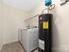 Laundry room with washer, dryer, and water heater at 1178 Valley St, Statesville, NC 28677