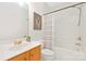 Bathroom with a shower and tub, along with a wooden vanity and neutral color scheme at 11805 Farnborough Rd, Huntersville, NC 28078