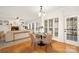 Charming breakfast nook with hardwood floors and view to the fireplace in the adjacent living room at 11805 Farnborough Rd, Huntersville, NC 28078